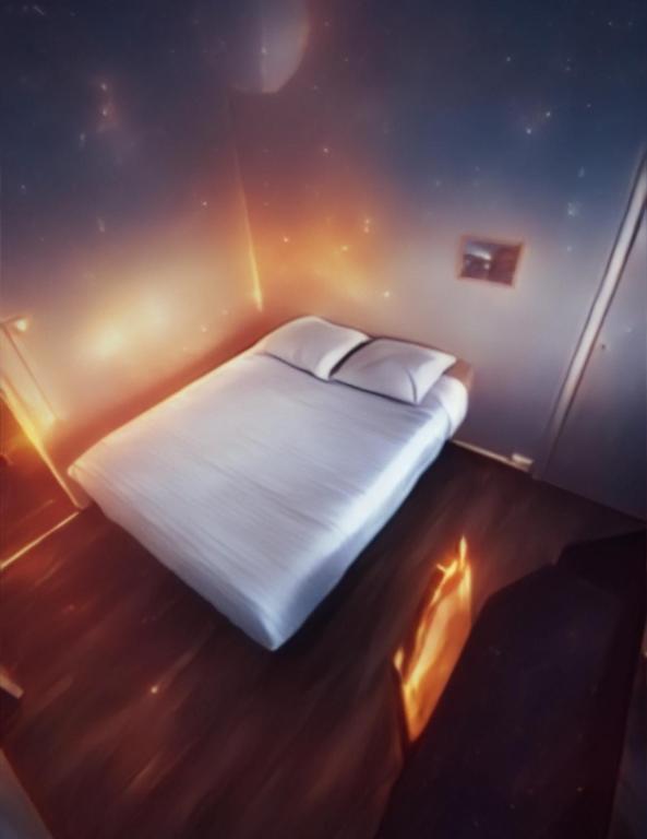 a bedroom with a white bed with lights on it at X1 Chambre appartement T3 cohabitation partie commune et salon in Chambéry