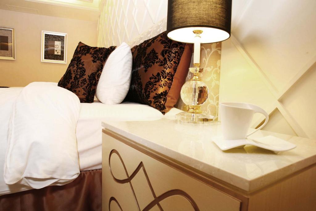 Postel nebo postele na pokoji v ubytování Chuang-Tang Spring SPA Hotel - Deyang