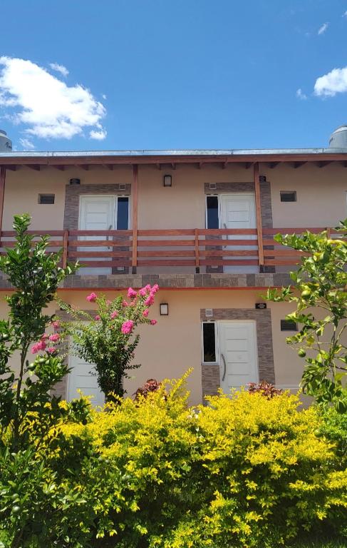an exterior view of a building with a balcony at Departamentos RIMASHA in Federación
