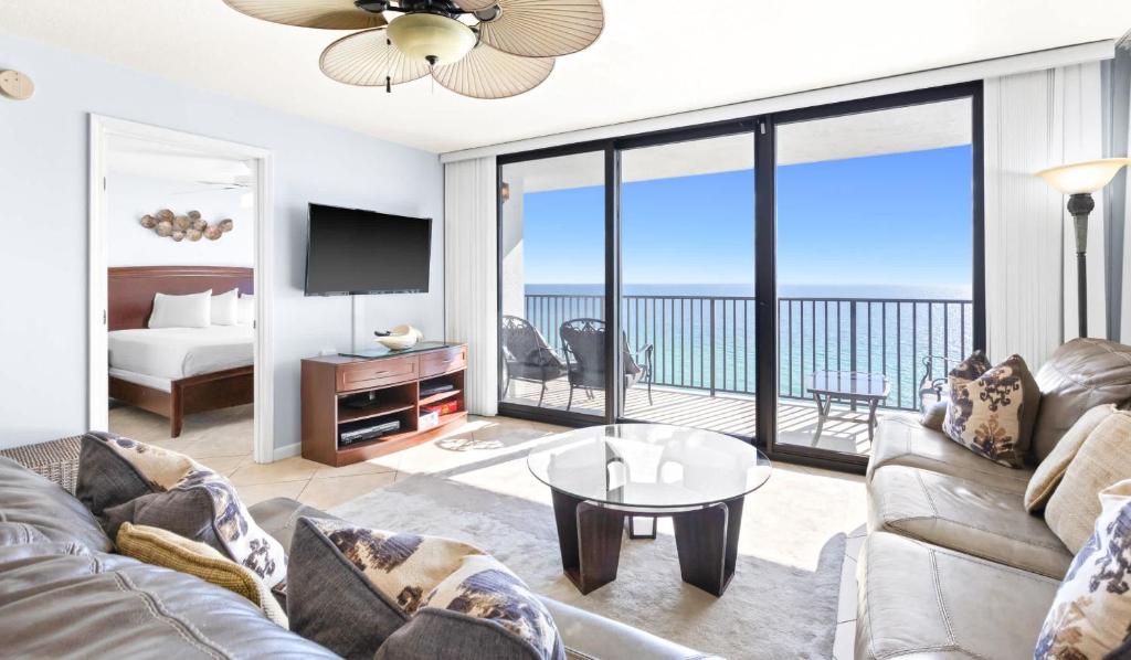 a living room with a couch and a view of the ocean at One Seagrove Place 1505 in Santa Rosa Beach