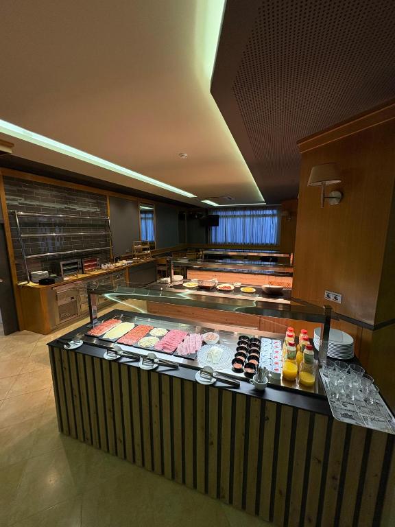 a buffet line with many different types of food on display at Hotel Teruel in Vinarós