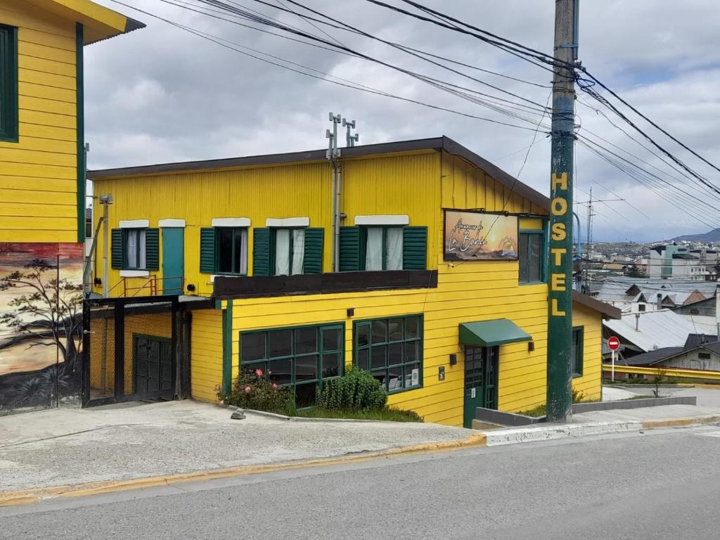 a yellow building on the side of a street at Amanecer de la Bahía in Ushuaia
