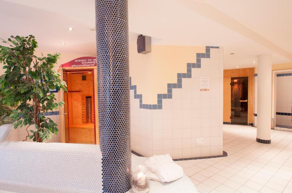 Rúm í herbergi á Hotel Alpenfriede