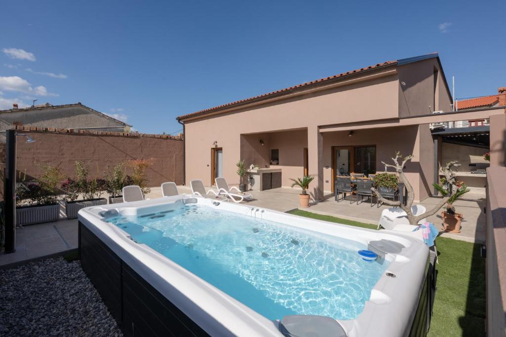 a swimming pool in the backyard of a house at House Hana 2415 in Vodnjan