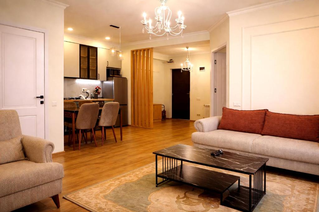 a living room with a couch and a table at Stylish House in Kutaisi