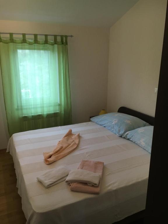 Łóżko lub łóżka w pokoju w obiekcie Apartments Rajic