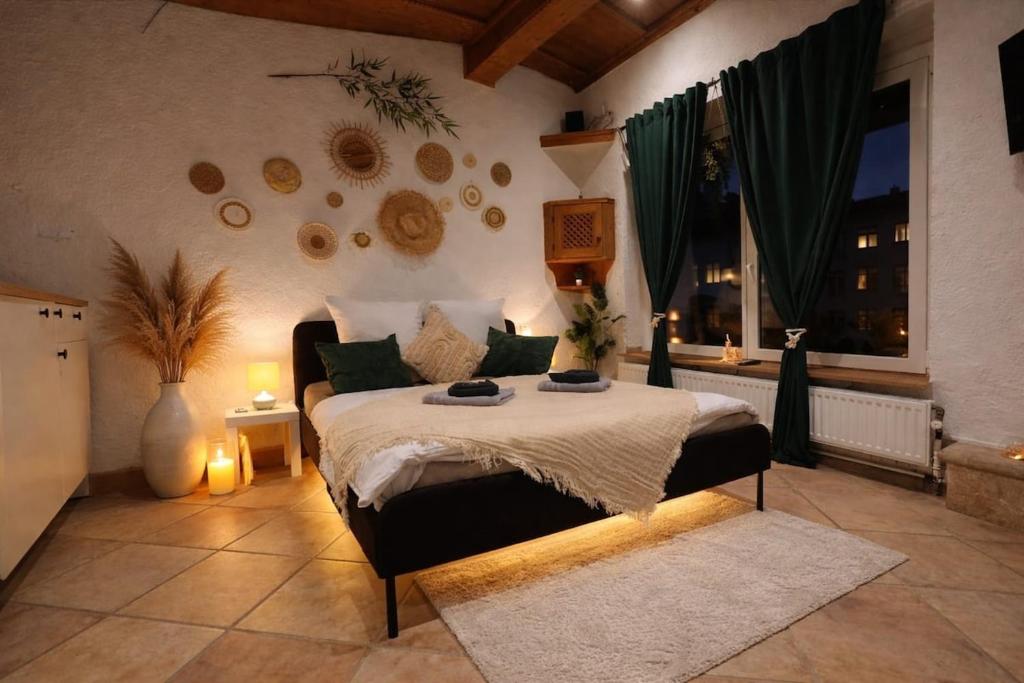 a bedroom with a bed in a room with a window at Green Oasis Stylish Garden Studio Workspace in Linz