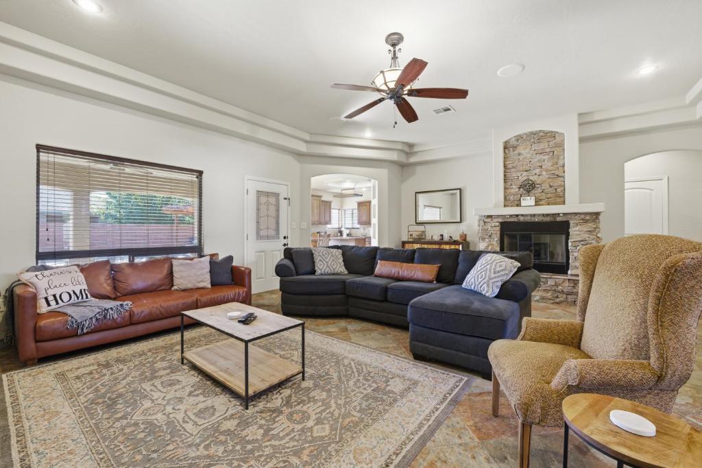 a living room with couches and a fireplace at The Palo in Alamogordo