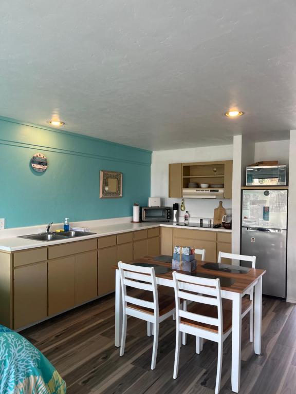 a kitchen with a table and chairs and a sink at Park Place Condo 227 in Cedar Key