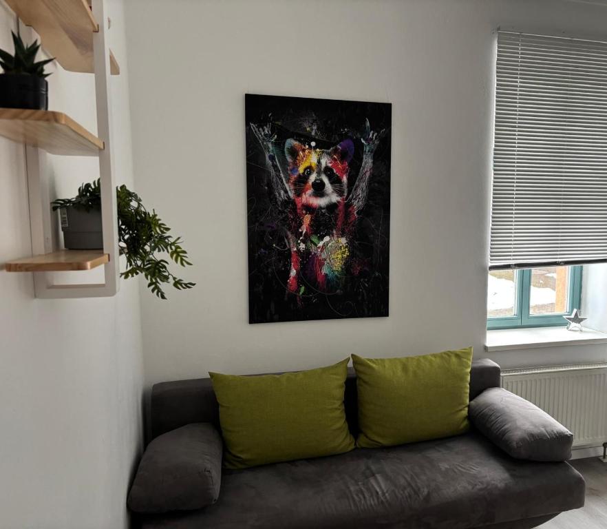 a painting of a dog on a wall at Wohnung am Auepark in Kassel