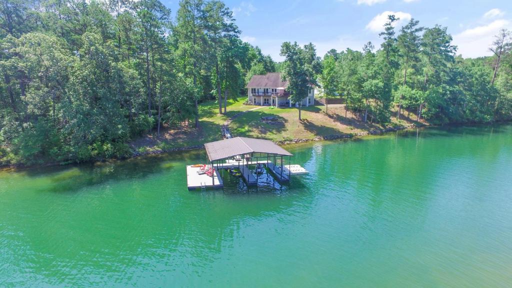 an aerial view of a house in the middle of a lake at L & L Lodge - Six Bedrooms! Popular House And Location! in Double Springs