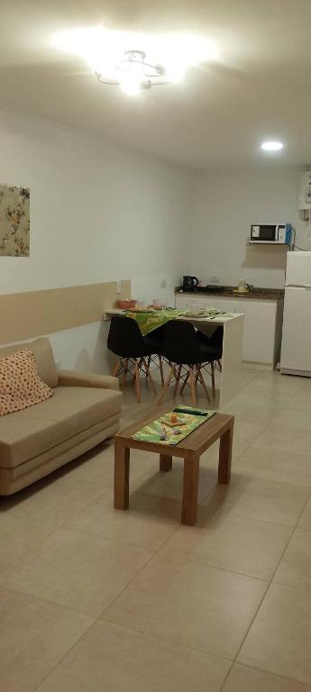 a living room with a couch and a table at Edificio San Jose in Federación