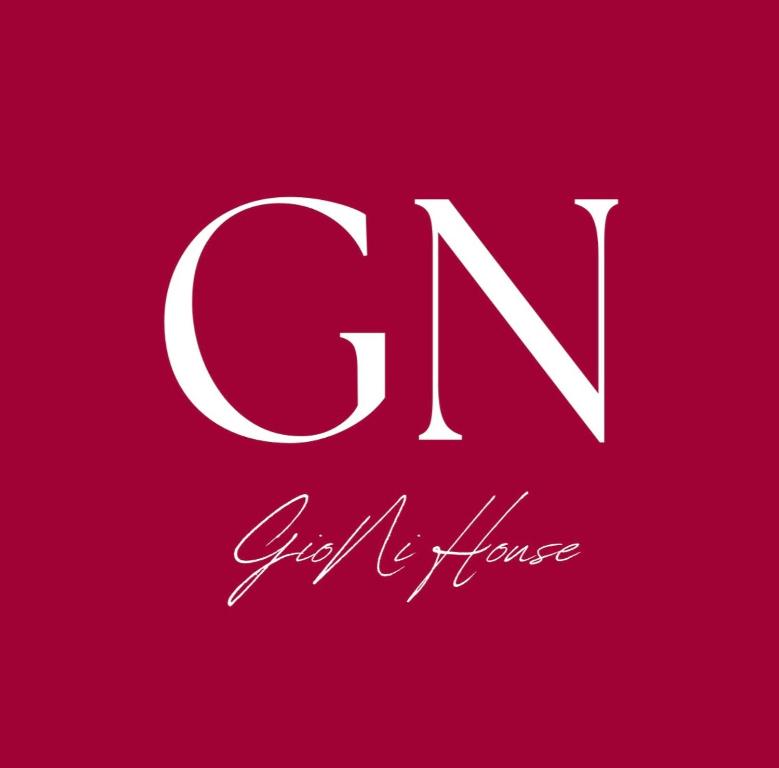 a letter g in white on a red background at GioNi HOUSE in Collegno