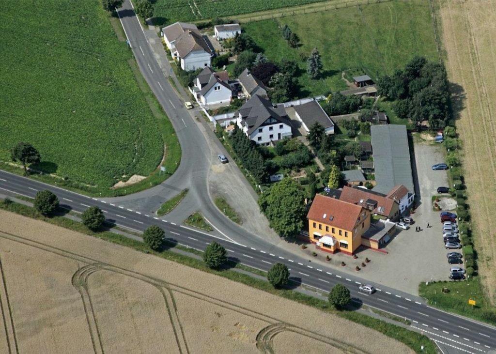 an aerial view of a small town with a highway at Hotel & Restaurant Friedrichshöhe in Braunschweig