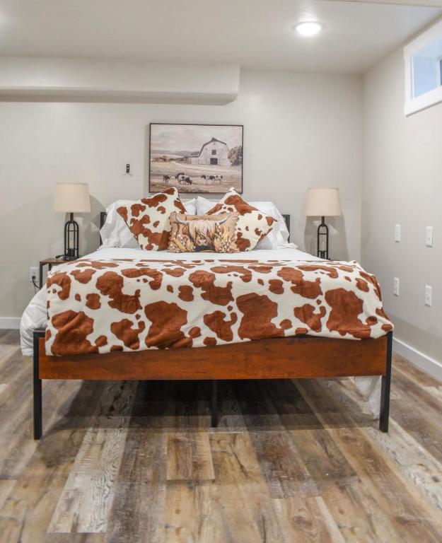 a bedroom with a large bed with brown at Basement apartment in Twin Falls