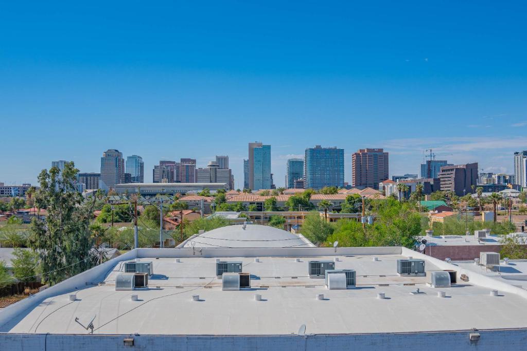 a roof of a building with a city in the background at Skyline Loft Studio w City Views in Phoenix