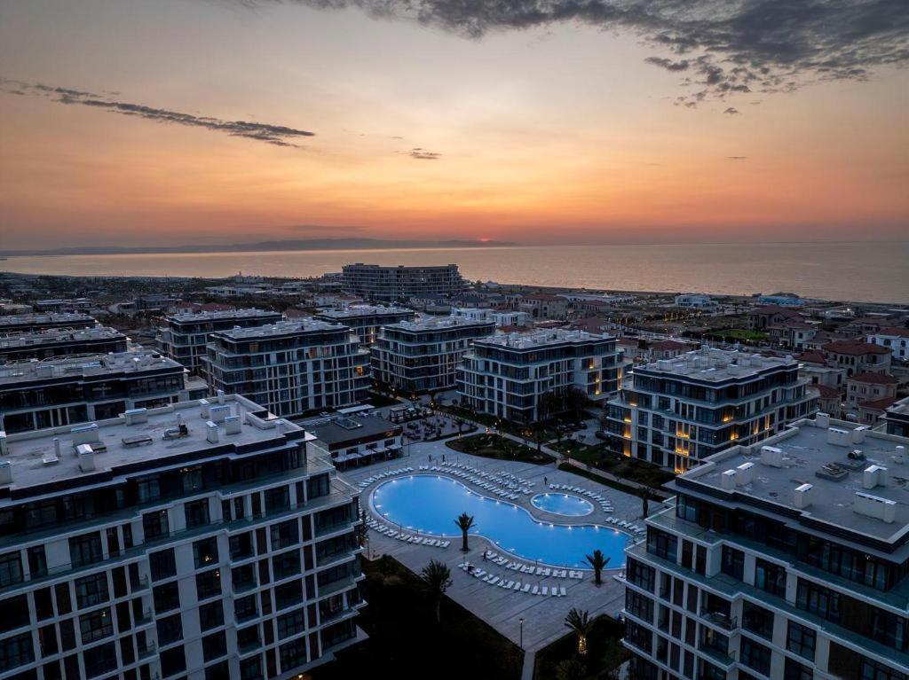 a view of a city with buildings and the ocean at Sea Breeze, Polo Residence, Baku, MR in Nardaran