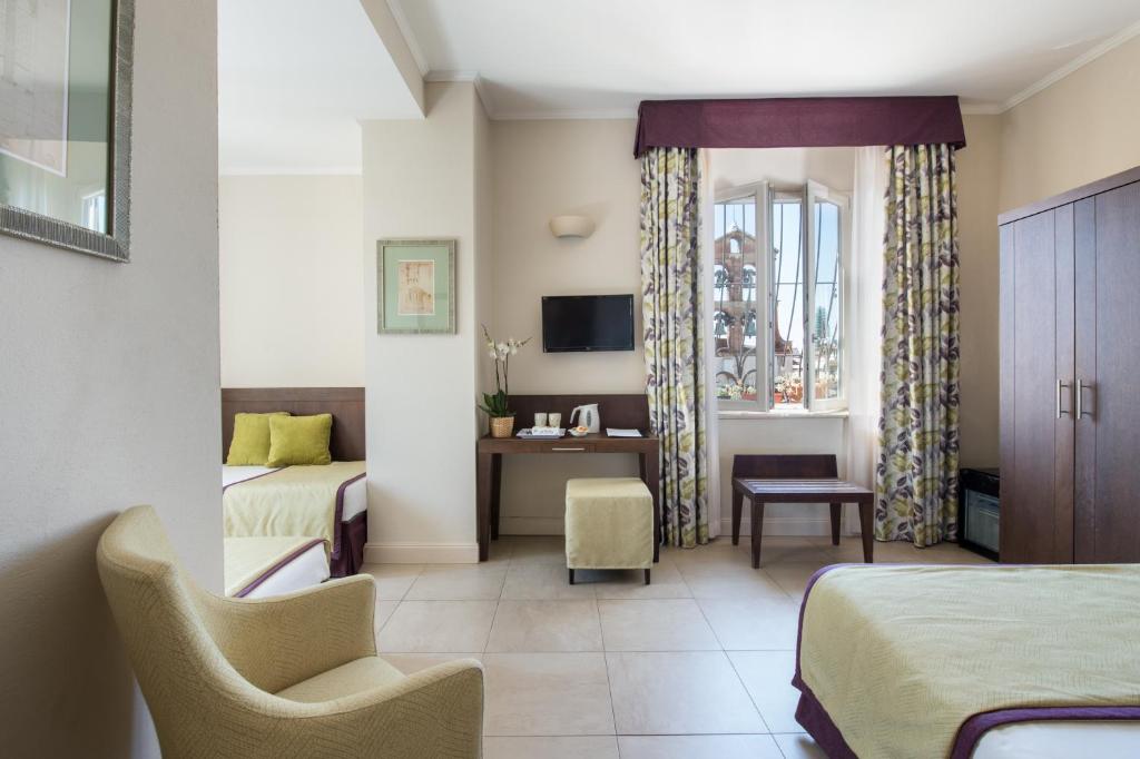 TV a/nebo společenská místnost v ubytování Hotel Perseo