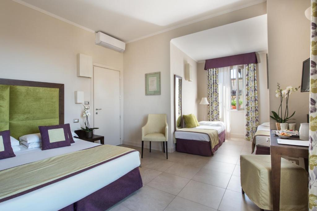 Postel nebo postele na pokoji v ubytování Hotel Perseo