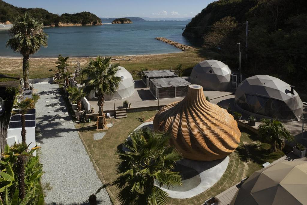 an aerial view of a resort with a large vase at Sanamane in Naoshima