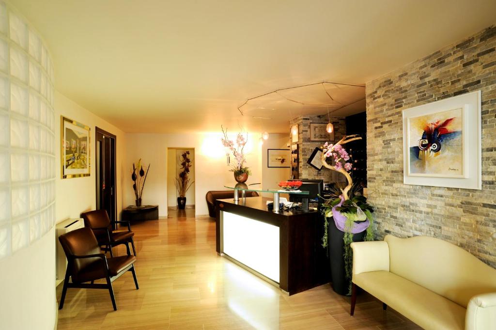 a living room with a counter and a brick wall at Hotel Concordia in Loano