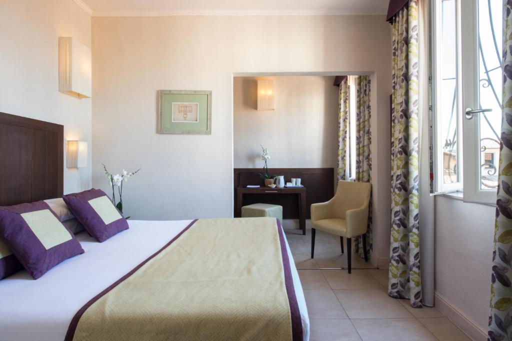 Postel nebo postele na pokoji v ubytování Hotel Perseo