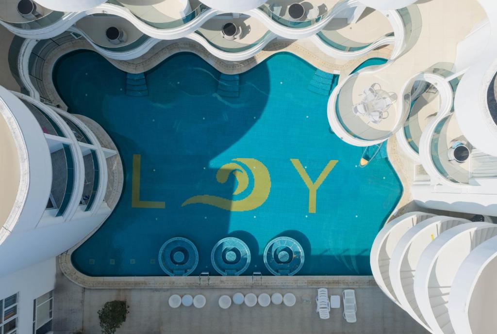 a building with the hy logo on it at Langying Intelligent Guesthouse in Sanya