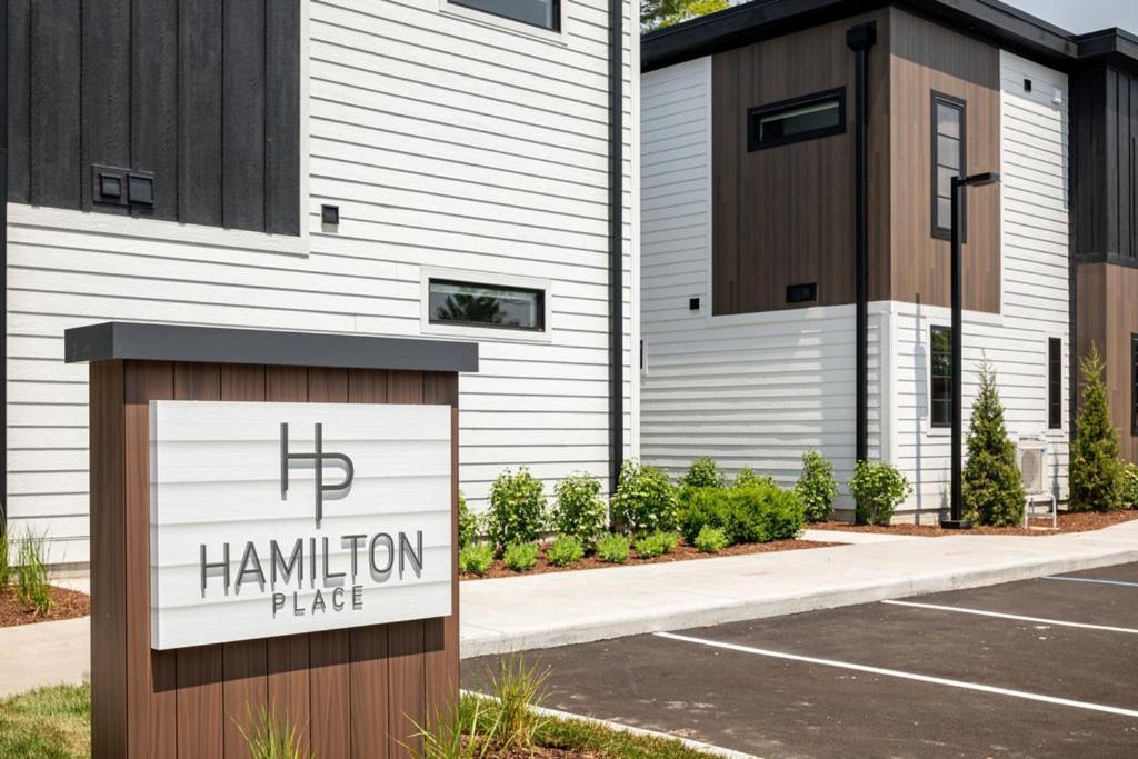 a sign in a parking lot in front of a building at Hamilton Place in Traverse City