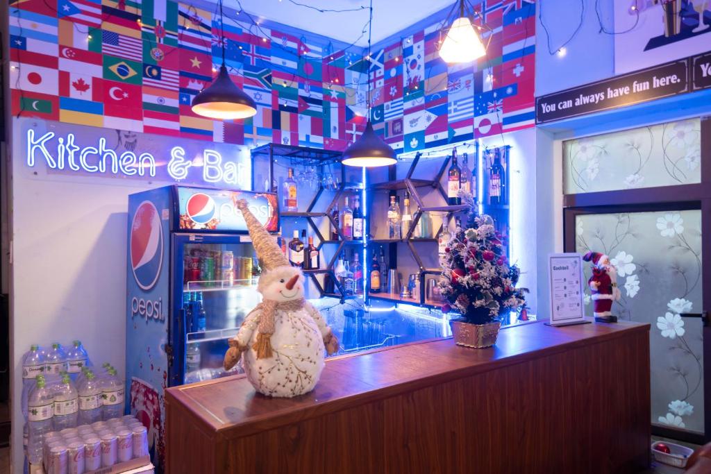 a shop with a stuffed rabbit sitting at a counter at Lola's House in Ha Long