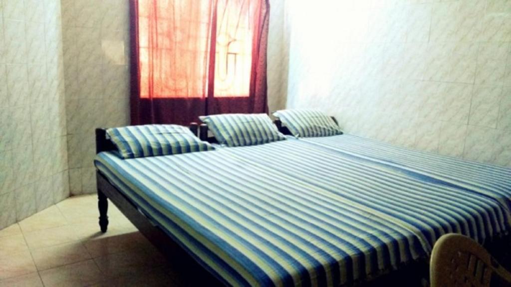 Postel nebo postele na pokoji v ubytování New Regency