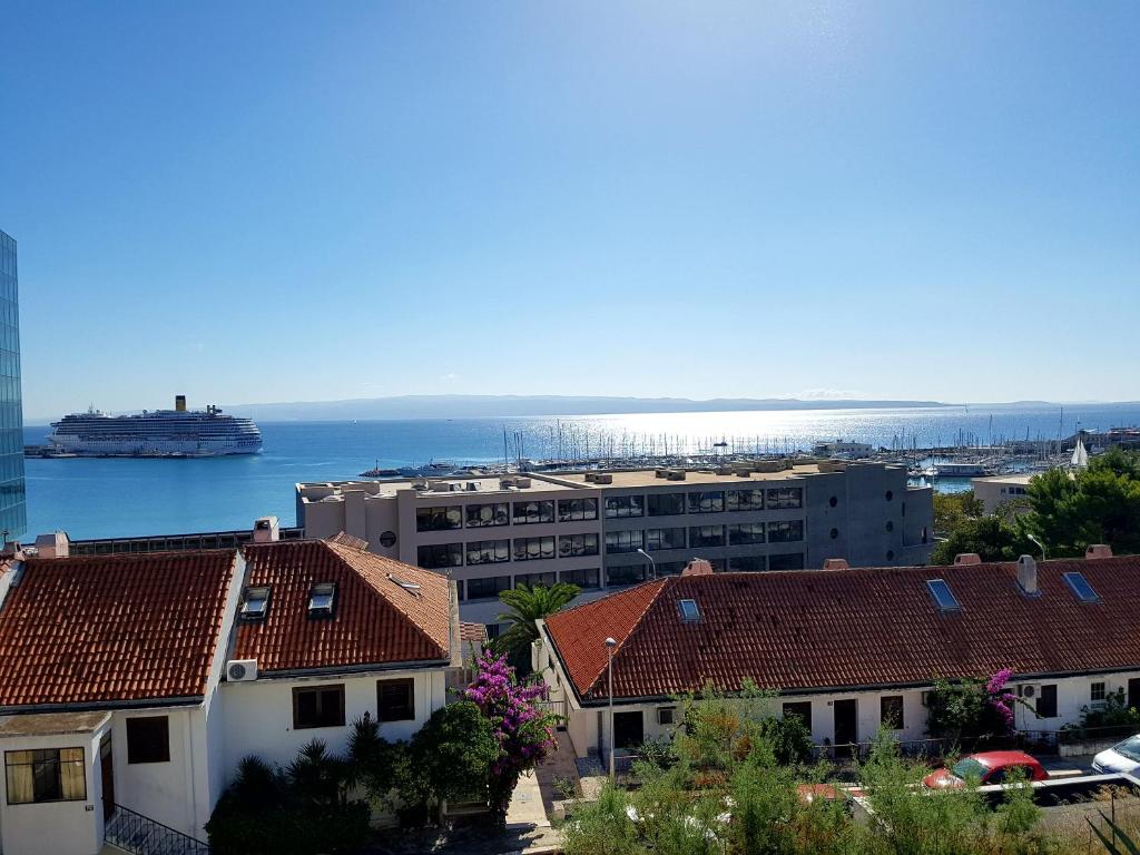 a view of a city with a cruise ship in the water at Apartments Kike&Ana in Split