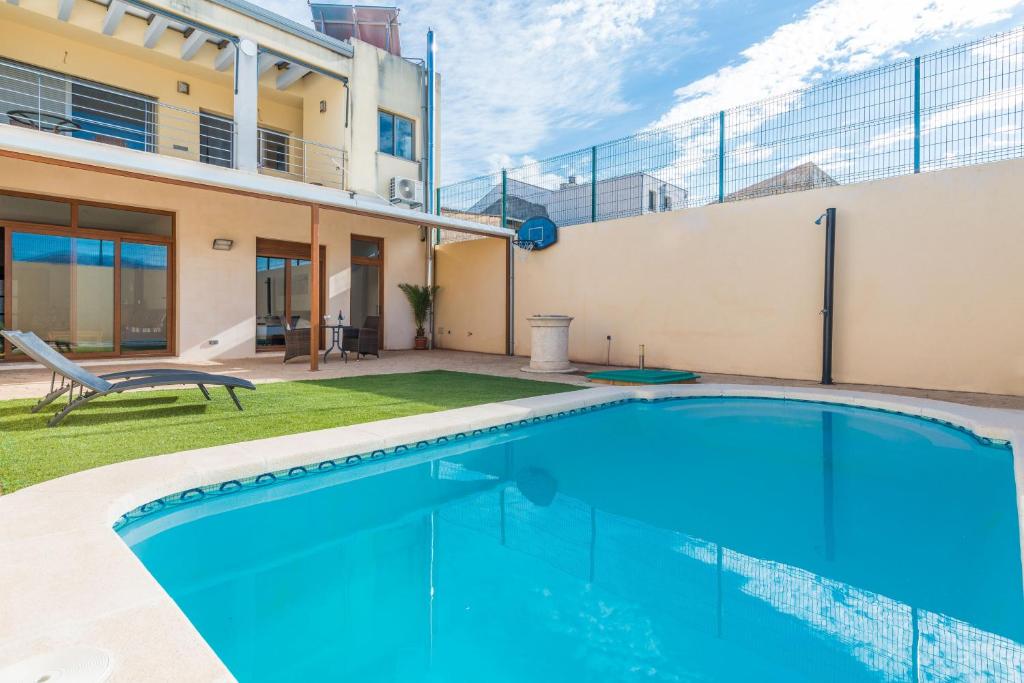 a swimming pool in the backyard of a house at Cas Peix - Adults Only in Sa Pobla