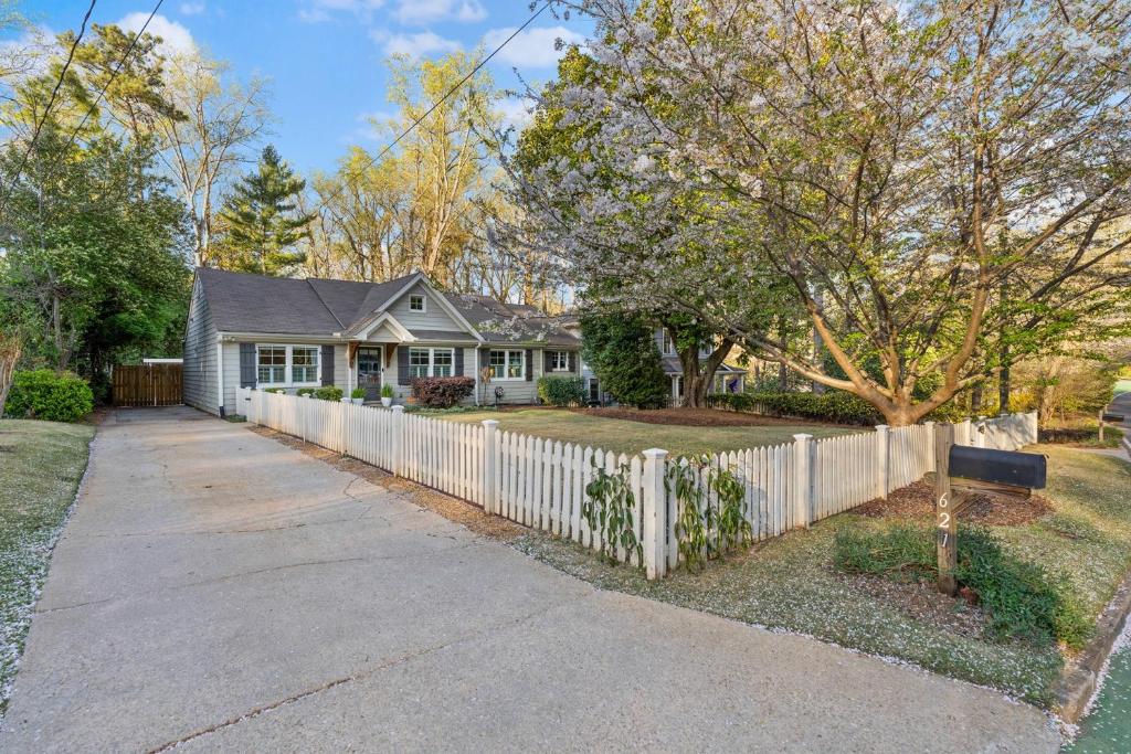 a white fence in front of a house at Private Compound in Decatur in Decatur