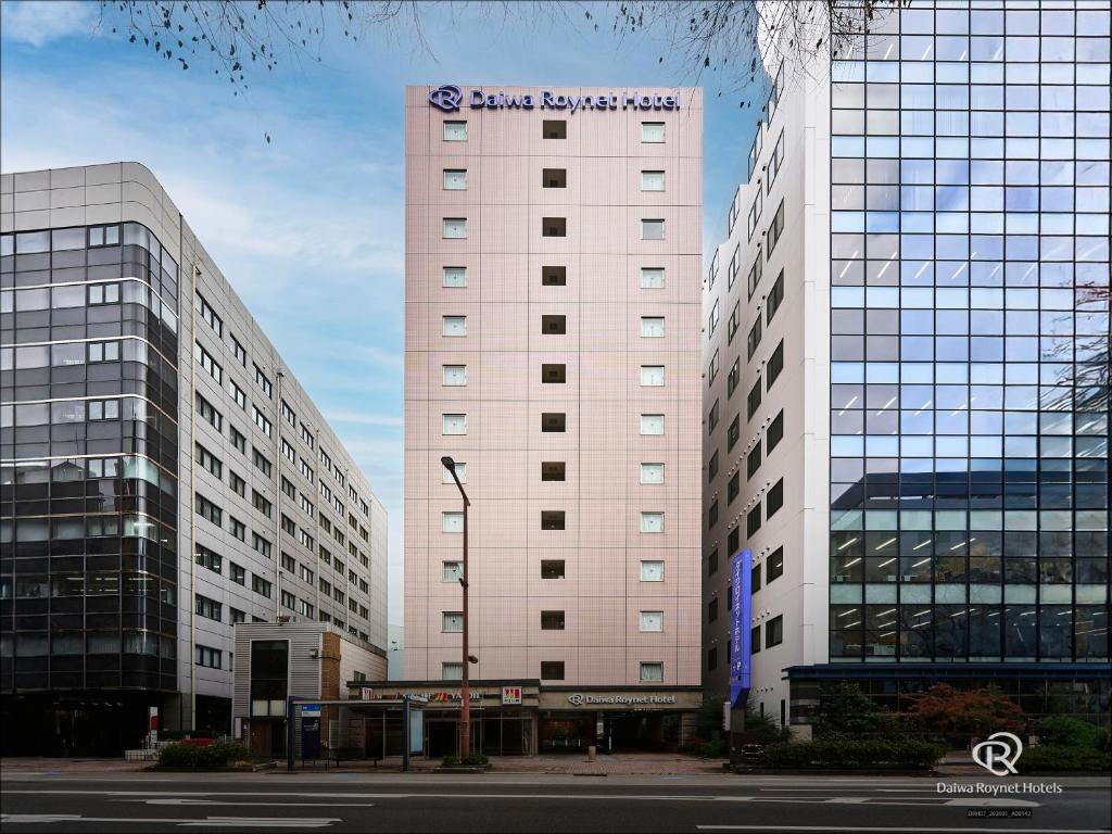a large white building with a sign on it at Daiwa Roynet Hotel Hakata-Gion in Fukuoka