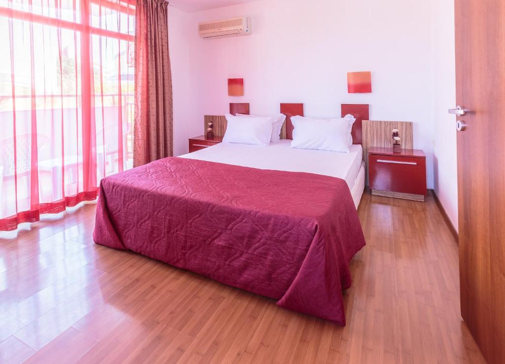 Postel nebo postele na pokoji v ubytování Hotel Apolis