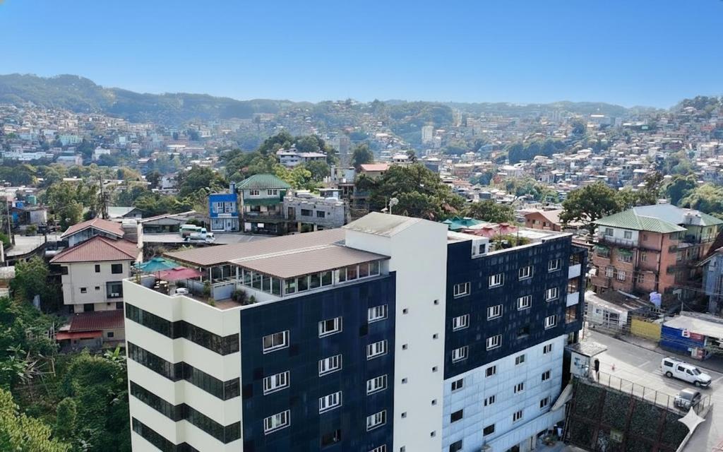 a view of a city from a building at Misty Hills in Baguio