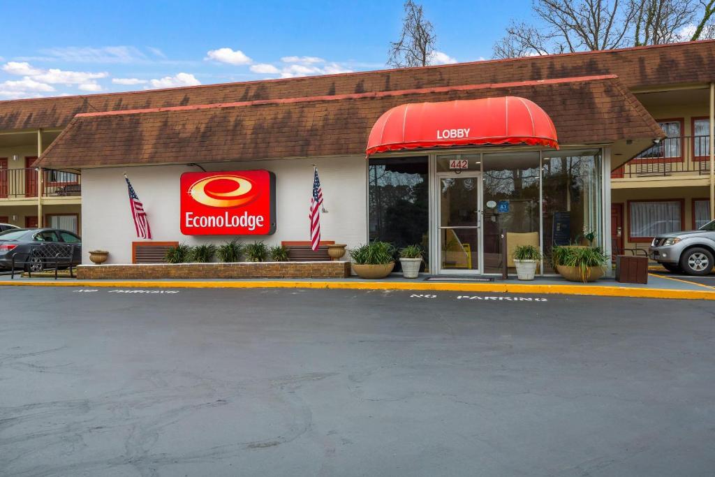 a mcdonalds restaurant with a red awning in a parking lot at Econo Lodge Williamsburg Historic Area in Williamsburg