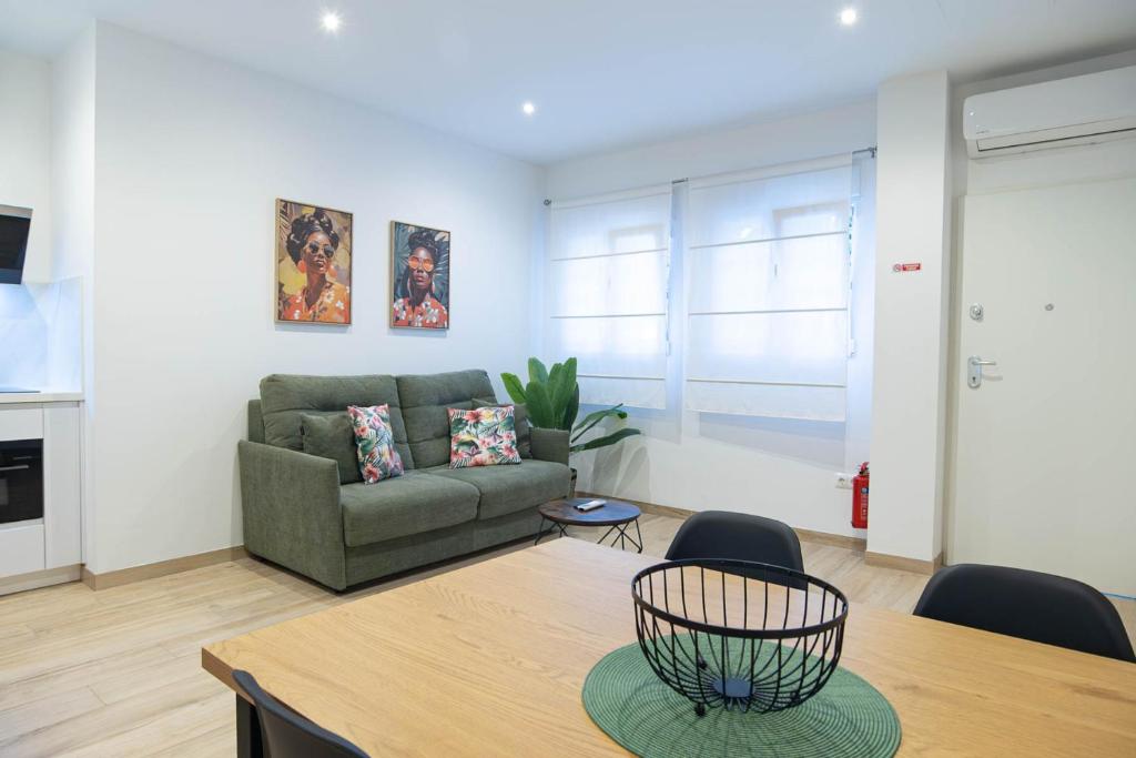 a living room with a couch and a table at Apartamento Terra in Benajarafe