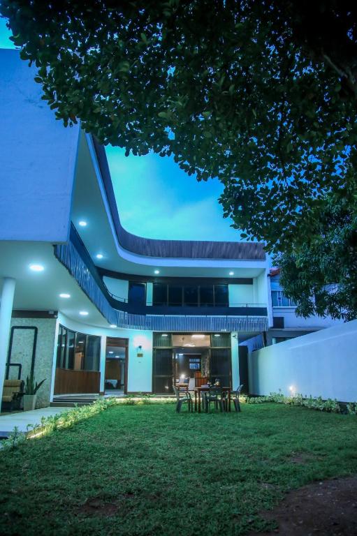a house with a lawn in front of it at BansriVilla Mount Lavinia in Mount Lavinia