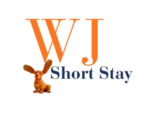 a letter t with a rabbit hanging from a letter j at WJShortlets - 48HarwellRd in Abingdon