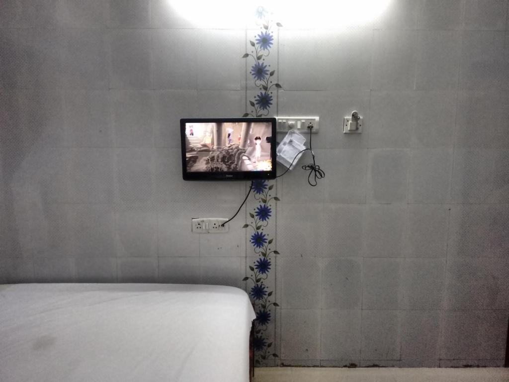 TV a/nebo společenská místnost v ubytování New Regency