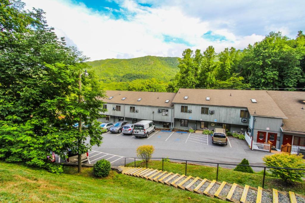 an aerial view of a building with a parking lot at Smoketree Lodge in Banner Elk