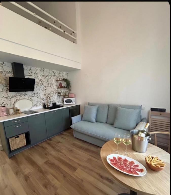 a living room with a couch and a table at Las Marismas-Puente del Rey in El Rocío