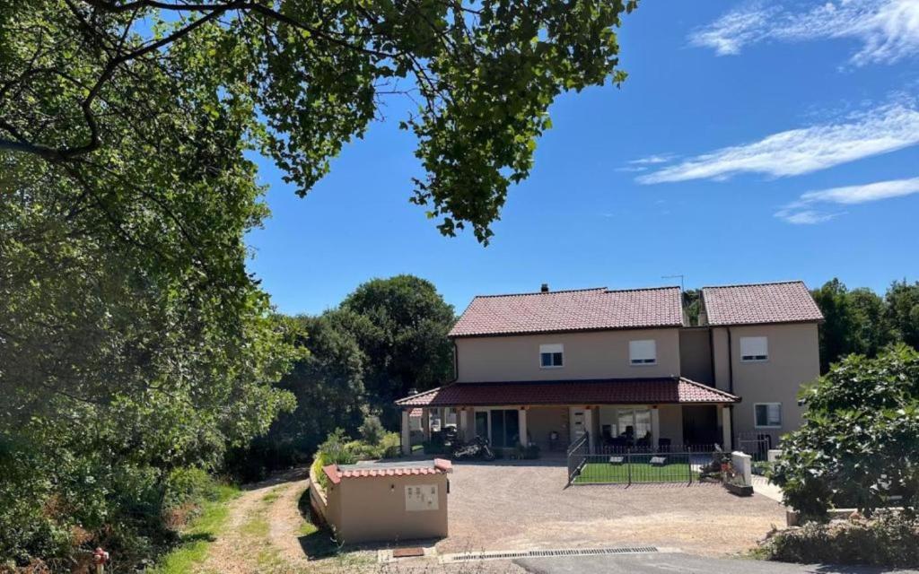 a large house with a yard in front of it at Zelena oaza in Krk