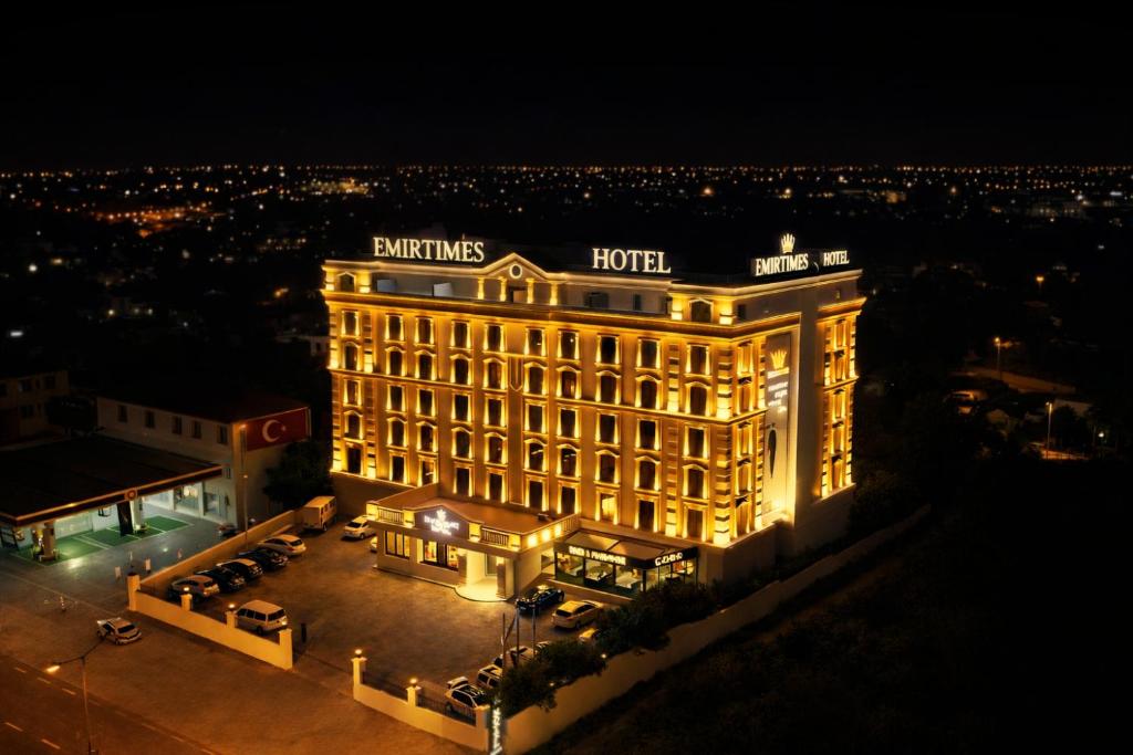 a building lit up at night with lights at Emirtimes Hotel&Spa - Tuzla in Istanbul
