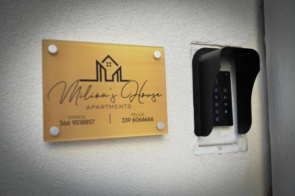 a sign on a wall that says military officersagents at Milion's House Apartments in Salerno