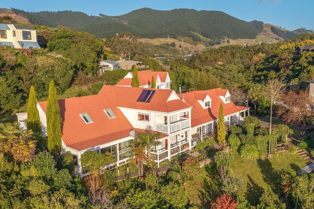 an aerial view of a large house with an orange roof at Charming homely Cherry Villa B&B with a panorama view in Paraparaumu