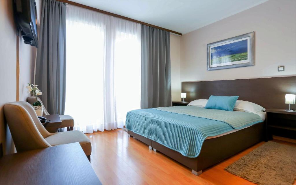 Postel nebo postele na pokoji v ubytování Hotel Divan