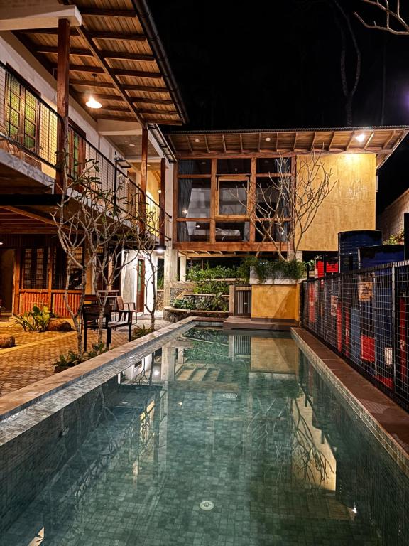 a swimming pool in the middle of a building at Barren House in Hiriketiya