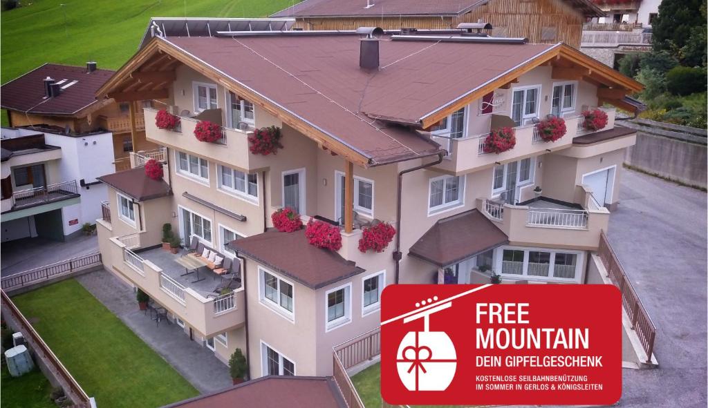 a house with a free mountain sign in front of it at Chalet Lena in Gerlos